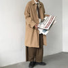 Chic Japanese vintage trench coat for men in black, featuring a single-breasted closure and stylish turn-down collar.
