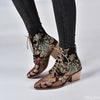 Beige mid-calf lace-up boots featuring intricate floral embroidery and low block heel