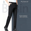 Professional man in breathable dress pants walking confidently through modern office corridor