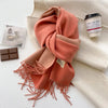 Stylish winter scarf in soft beige, ideal for casual outings and winter accessories.
