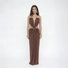 Sophisticated ankle-length dress featuring halter neck, bare back, and side cutouts