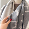 High-quality cashmere shawl in floral pattern, a must-have winter accessory.