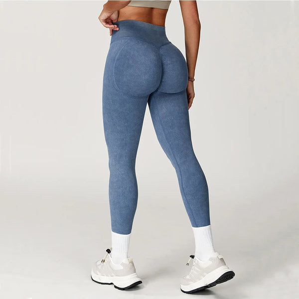 Black seamless high waist yoga leggings for women with ribbed texture.