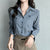 Chic striped blouse for office elegance, featuring a turn-down collar and single-breasted closure, perfect for professional w