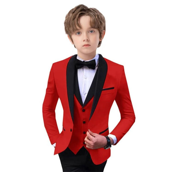 Boy adjusting his tie, completing the sophisticated look of the dapper suit.