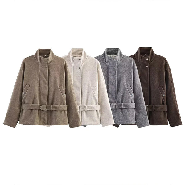 Women's zip-front jacket with sash belt cinched at waist creating tailored look