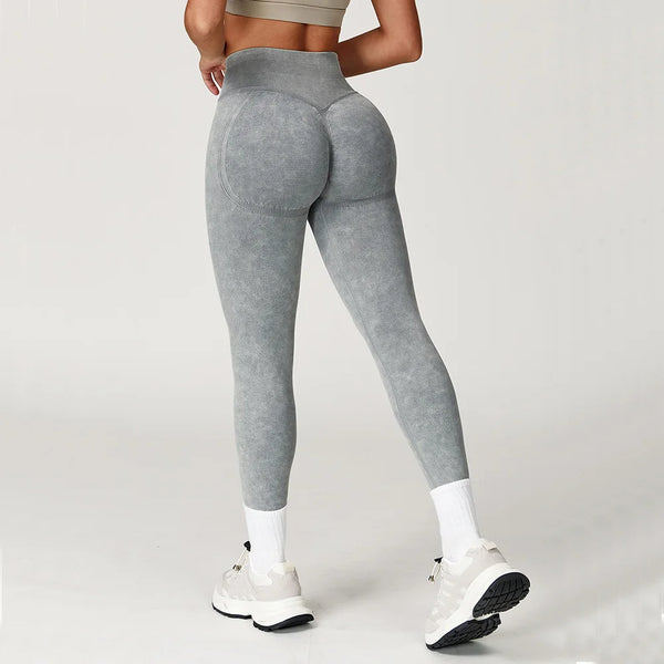 Light pink high waist leggings with elastic waistband for comfort.