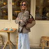 Travel-ready broadcloth blazer with functional pockets for everyday wear
