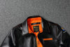 Vintage A2 leather flight jacket displayed against a rustic background.