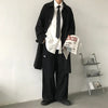 Chic Japanese vintage trench coat for men in black, featuring a single-breasted closure and stylish turn-down collar.
