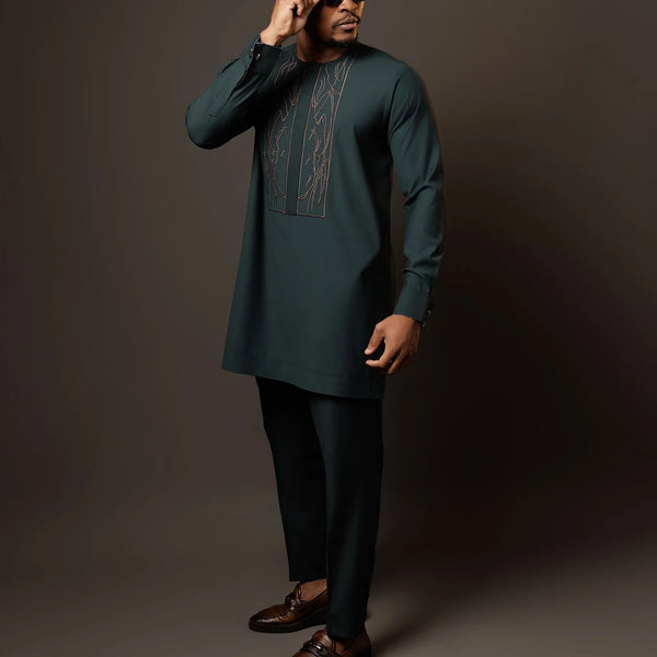 Close-up of shirt front showcasing intricate African patchwork design and vibrant color palette