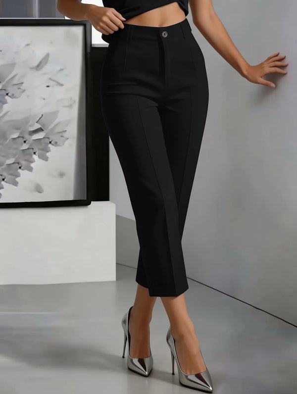 Close-up of high-waist trouser waistband showing flattering fit and tailored construction