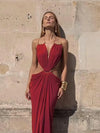 Summer evening dress with halter top, exposed back, and modern waist cutouts