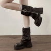 Chic women's mid-calf biker boots with buckle detail, zipper closure, and plush lining for comfort and style in cooler weathe