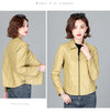 Chic women's sheepskin leather jacket with zippered front, turn-down collar, and pockets for stylish autumn layering.