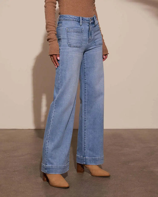 Chic high-waisted wide-leg jeans for women, featuring a relaxed fit, distressed details, and practical pockets for stylish co