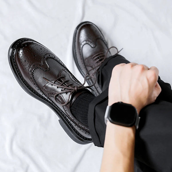 Men's formal footwear with a solid pattern and slip-on design.