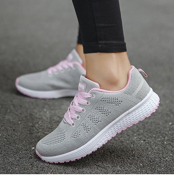 Comfortable white athletic shoes featuring multi-color design for women