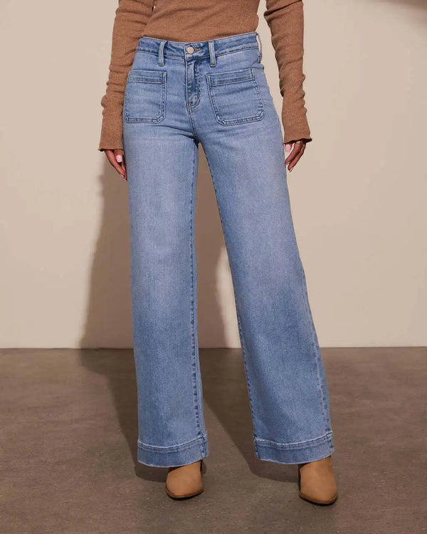 Chic high-waisted wide-leg jeans for women with pockets, distressed details, and a comfortable cotton blend for stylish wear.