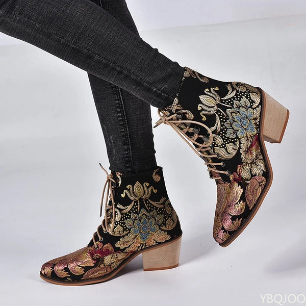 Statement embroidered boots combining bohemian charm with modern block heel silhouette