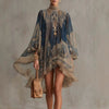 Feminine white dress featuring puff sleeves and intricate embroidered detailing