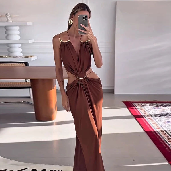 Summer formal dress with halter top, backless silhouette, and waist cutout accents