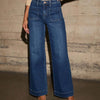 Chic high-waisted wide-leg jeans for women with pockets, distressed details, and a flattering ankle-length fit.
