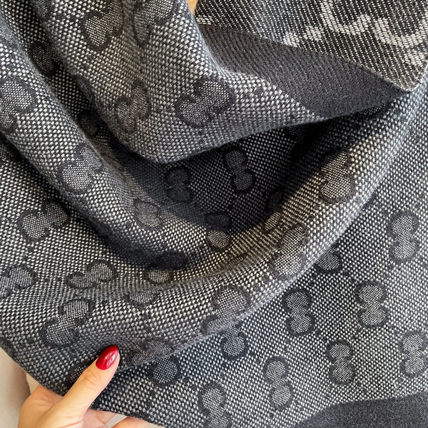 Versatile cashmere shawl styled with fringes, ideal for both casual and formal looks.