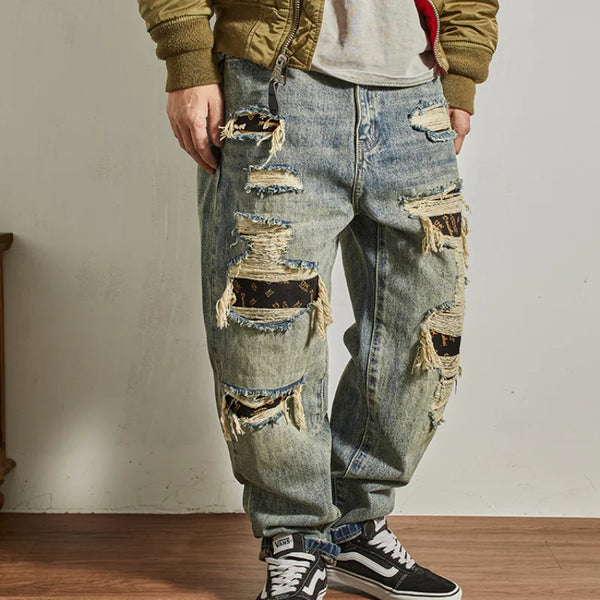 Model wearing Rebel Spirit Distressed Jeans, perfect for outdoor adventures and casual outings.