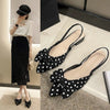 Sophisticated beige sandals with pointed toe design and charming bow embellishment
