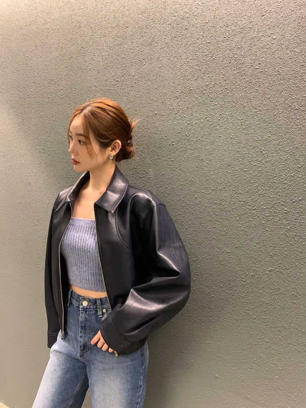 Chic cropped leather jacket for women in faux leather, featuring a turn-down collar and zipper closure, perfect for autumn an