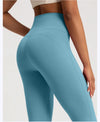 Model in high-waist wide-leg yoga pants, demonstrating freedom of movement.