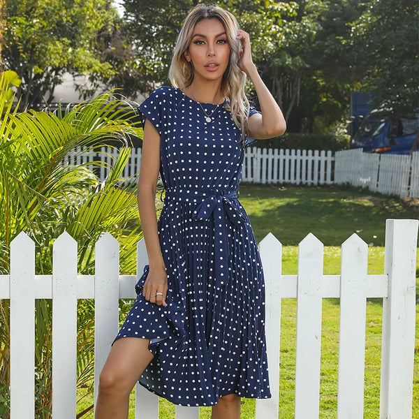 Knee length polka dot dress with elegant pleated design