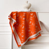 Warm winter scarf in rich cashmere, adorned with vibrant floral motifs.