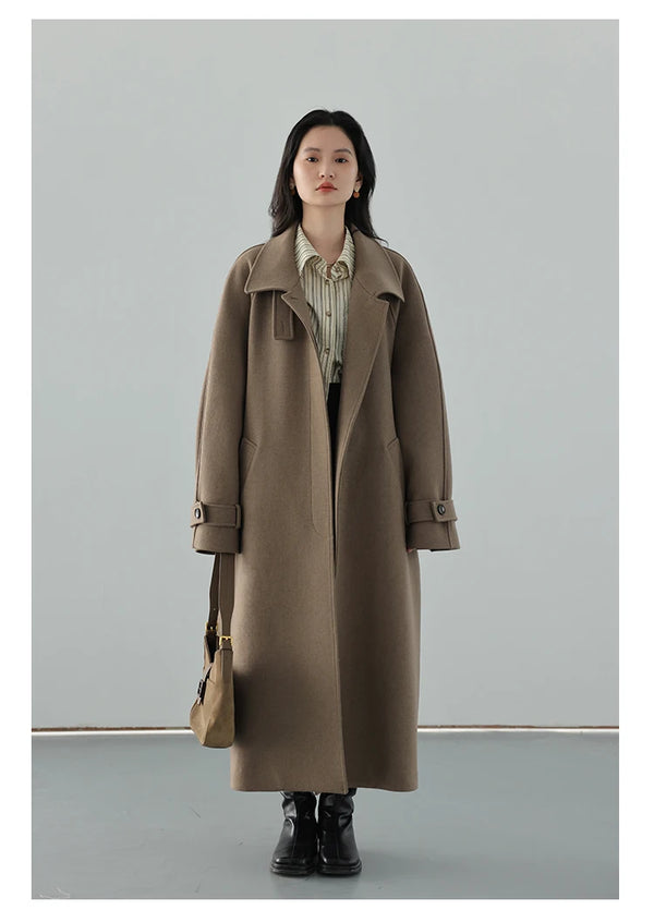 Polished trench coat showcasing belted waist and warm turtleneck design