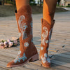 Embroidered mid-calf women's fashion boots with low wedge heel, slip-on design, and durable rubber outsole for comfort and st