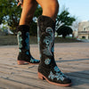Embroidered mid-calf women's fashion boots with low wedge heel, slip-on design, and durable rubber outsole for comfort.