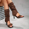 Mid-calf sandal boots with slim stiletto heel and mixed material construction