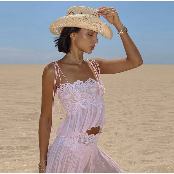 Woman in elegant lace ensemble at summer evening event