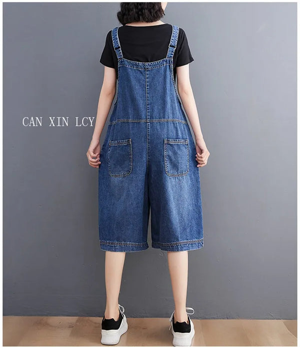 Cotton-polyester denim jumpsuit featuring comfortable loose fit and playful retro suspender details
