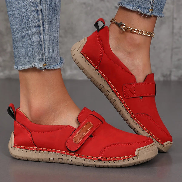Women wearing leather slip-on loafers with tailored trousers for casual office style