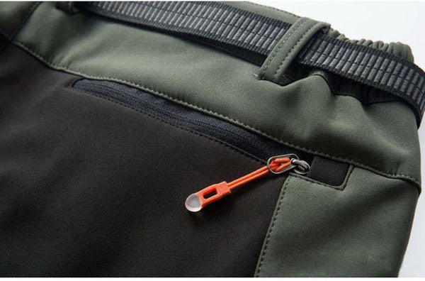 Technical outdoor pants featuring waterproof shell and cozy fleece interior