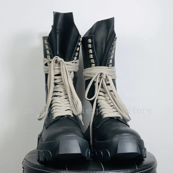 Side view of unisex leather high-top sneakers showcasing mid-calf rise.