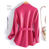 Chic women's sheepskin leather jacket with turn-down collar, lace-up belt, and adjustable waist for a stylish fit.