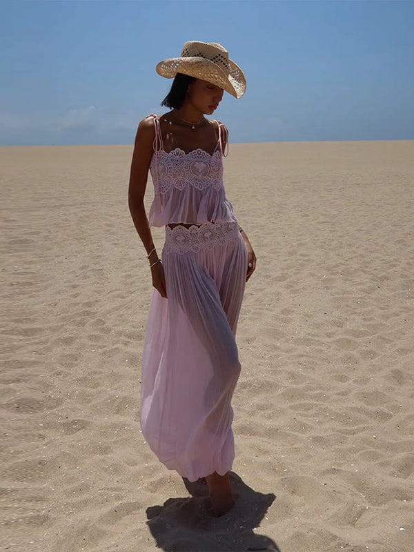 Flowing palazzo-style trousers creating graceful silhouette in white polyester