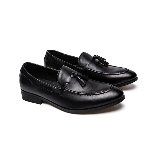 Back view of stylish black loafers emphasizing their seamless fit and design.