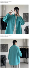 Oversized long sleeve casual shirt for men and women with Mandarin collar, perfect for spring and autumn street fashion.