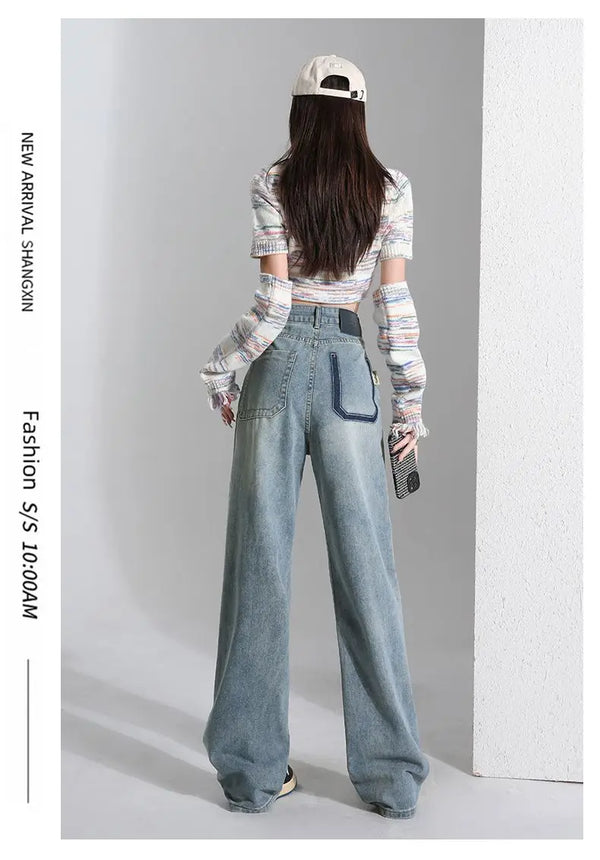 Sunset Boulevard Denim jeans paired with sneakers for a relaxed streetwear look.