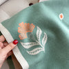 Warm and cozy winter scarf for women, featuring an elegant leaf design.