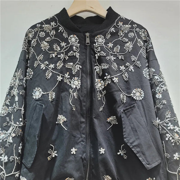 Back view of embroidered sequin jacket showing spliced detailing and construction